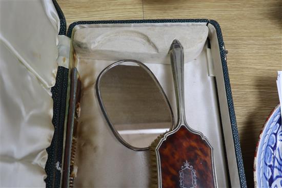 A cased plated and tortoiseshell brush set